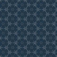 Luxury silver pattern with outlines of hexagons on a dark background
