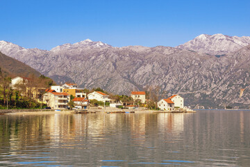 Fototapeta premium Beautiful Mediterranean landscape. Montenegro, Adriatic Sea. View of Bay of Kotor and Stoliv village on sunny spring day