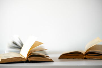opened old book on the table as the symbol of wisdom and knowledge, education concept