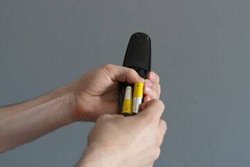inserting aa battery in the portable device, full charge