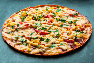 delicious pizza close up. carbonara with fresh vegetables. large pie with vegetable filling. fast food concept