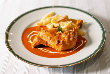 Hungarian Chicken Paprikash with Spaetzle, a Chicken Leg with Paprika Sauce and Small Dumplings