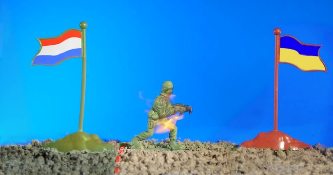 Plastic toy russian soldier from russian army crossed the border, destroyed on Ukrainian land. War in Ukraine, stop russian agression concept. Strength and courage of Ukraine. Blue screen 