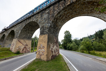 Fototapeta premium Old railway arch bridge. Panorama.