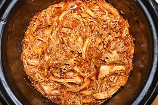 Shredded  Bbq Chicken Cooking In A Crockpot