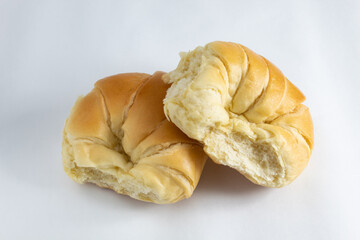 Two delicious fresh and fluffy croissants stacked, for breakfast or snack on white background