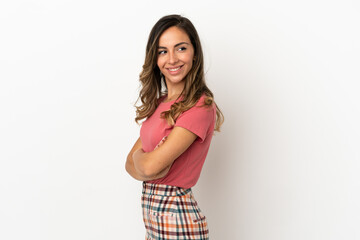 Young woman over isolated background with arms crossed and happy