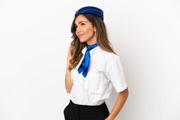 Airplane stewardess over isolated white background thinking an idea