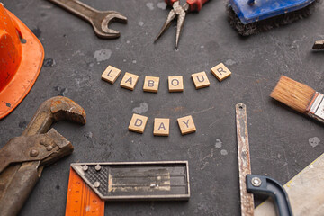 Happy Labor Day on blackboard with wrench