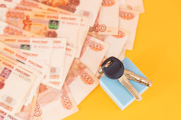 Home keys on currencies background. The concept of renting or selling house or flat, mortgage, investment or real estate, property buying. Money for the housing plan.rental concept.