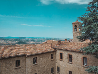 Fototapeta na wymiar Rooftops and scenic landscape views from San Marino, San Marino - 12.07.2021