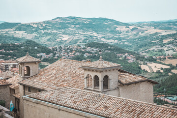 Fototapeta na wymiar Rooftops and scenic landscape views from San Marino, San Marino - 12.07.2021