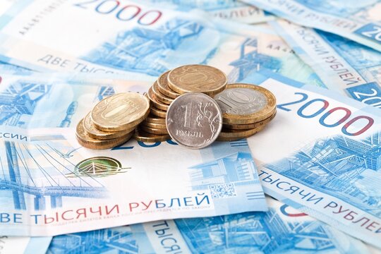 Russian coin on russian rubles money. Different denomination of bills. Finance concept. Money background and texture.
