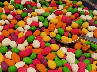 Fototapeta na wymiar delicious treats in many colors in a basket