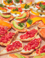 Catering table, beautifully decorated banquet with variety of with different food snacks and appetizers on corporate birthday party event or wedding celebration, delicatessen setting