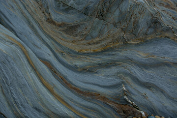 Stone abstract natural background of  rock with strange texture on the beach