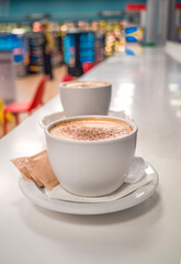 cup of coffee on a table, close up of two cups of coffee, cup of cappuccino coffee with copy space