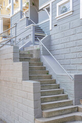Outdoor stairs with concrete block walls heading to the house at San Francisco, California