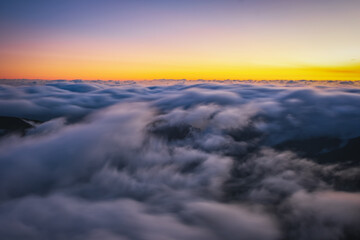 Mountain trail Pico do Arieiro, Madeira Island, Portugal Scenic view of steep and beautiful mountains and clouds during sunrise. October 2021. Long exposure picture