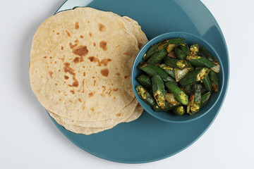Bhindi masala or ladies finger fry served with indian roti chapati or Indian Flat bread