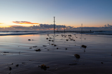 Seaweed and sand pattern in the morning at Mona Vale Beach, Sydney, Australia.