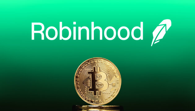 Cali, Colombia - April 20, 2022: Bitcoin BTC representation coin with Robinhood logo in background. Robinhood is an online discount brokerage that offers a commission-free investing and trading.