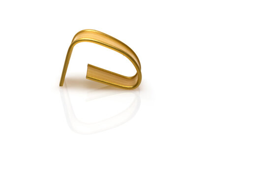 Closeup golden foil closure wire white background