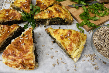 Traditional homemade pie with spinach and cheese.