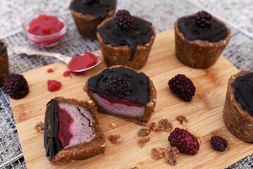 Mini chocolate cake or brownie with cream and berries.