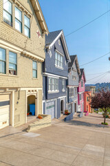 Suburbs houses with colorful painted wood sidings in San Francisco, California