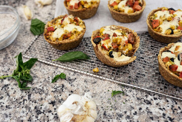 Fototapeta na wymiar Protein breakfast egg muffins with bacon and vegetables. Low carb diet breakfast.