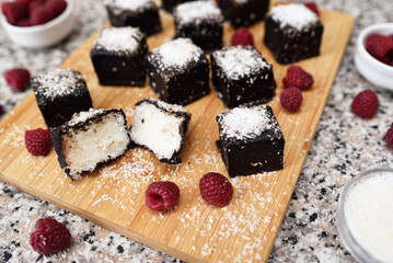 Home made delicious coconut brownies topped with chocolate.