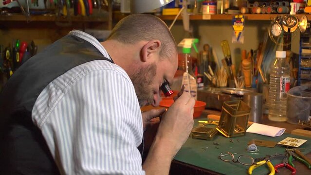 Clockmaker working on a carriage clock