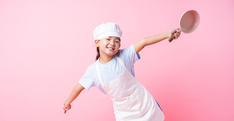 Naklejka premium Image of Asian child practicing to be a chef