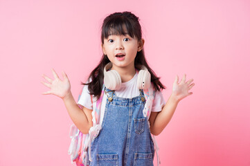 Image of Asian primary school student on pink background