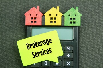 colored wooden houses, calculators and conversation boxes with the word brokerage services