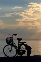 Set of photos, silhouettes, tourists and bicycles