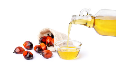 Palm oil in glass bowl and fresh oil palm fruit on white background.