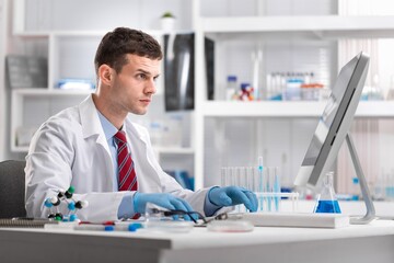 Medical Scientist Working in Science Laboratory on Personal Computer Virus Analysis Software . Scientists Developing Vaccine, Drugs and Antibiotics.