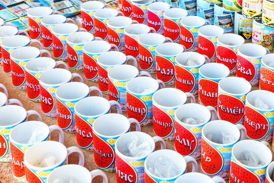 Russia, salt-Iletsk, August 2017: glasses with a name standing in a row in the market. Text in Russian: Varya Semyon Aydar Eugenia Darina Lydia Timothy Ira Zhanna Stanislav and other names.