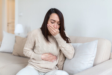 Closeup portrait of Asian unhappy, annoyed, sick woman about to chuck, throw up, puke retch barf....
