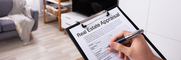 Obraz premium Man Filling Real Estate Appraisal Form