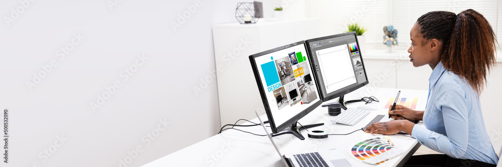 Poster designer editing photos on computer
