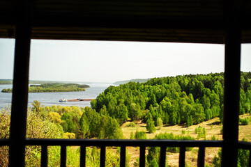 Fototapeta premium Picturesque view from the terrace to the forest and the river. summer season