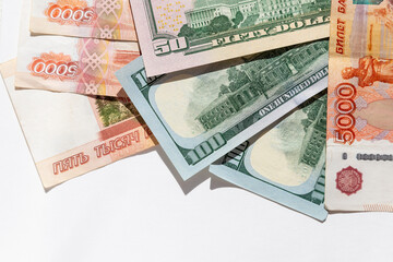 Different money in banknotes of 50,100 dollars and Russian rubles. rouble and USA dollar...