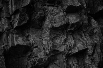 Black white rock texture. Mountain surface. Close-up. Volumetric stone background with space for design. Grunge backdrop.
