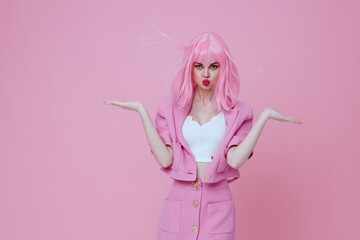 Fototapeta na wymiar Portrait of a charming lady bright makeup pink hair glamor monochrome shot unaltered
