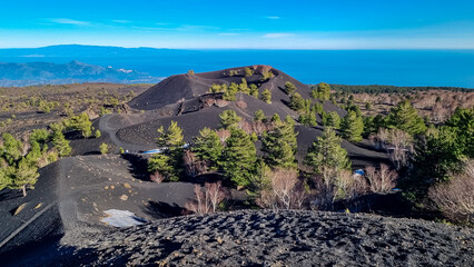 Scenic view on crater of Sartorio on volcanic landscape of volcano mount Etna, in Sicily, Italy,...
