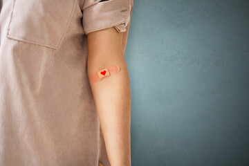 Blood Donation Concept. Donor With Band Aid