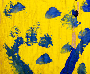 Blue and yellow paint on paper. Abstract